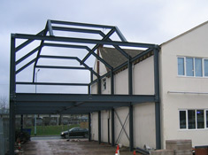 Steel frame supporting external wall, roof and floor